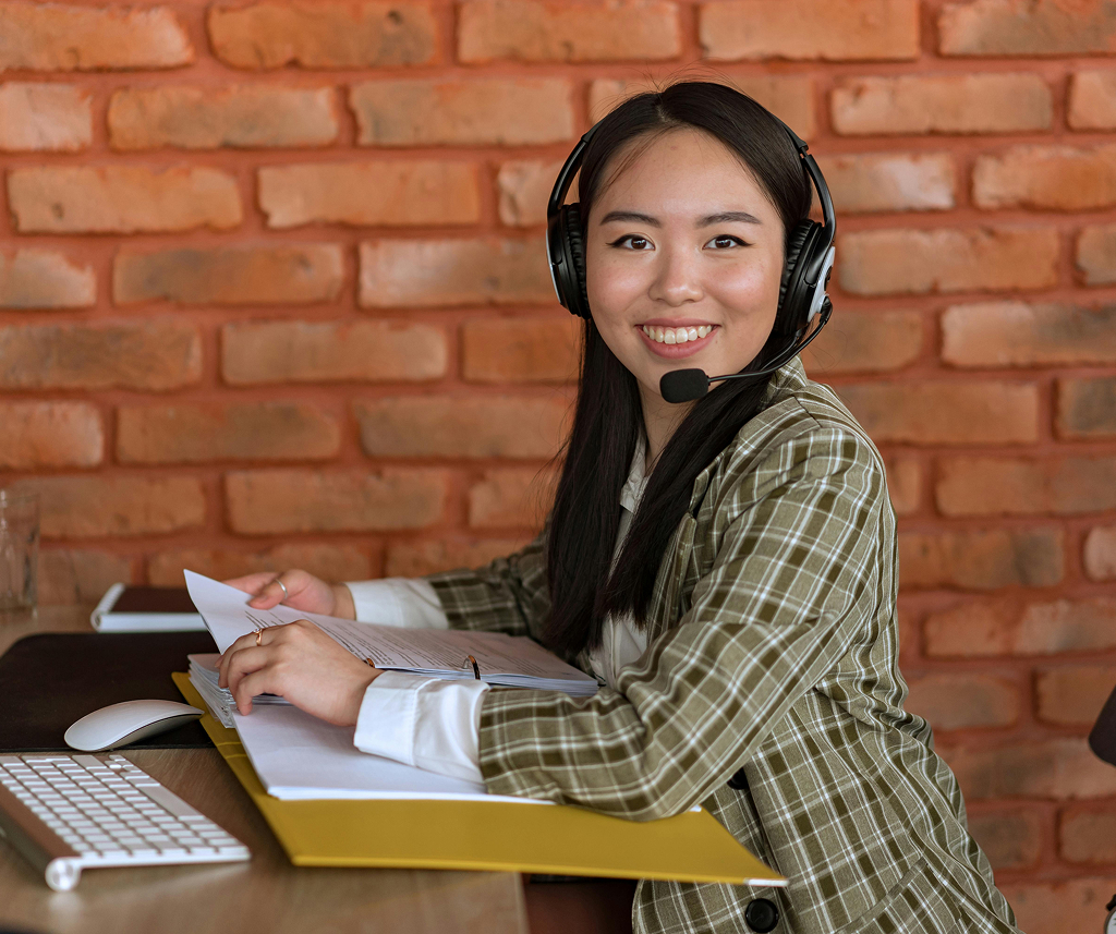 Professional working at a computer in a modern office environment